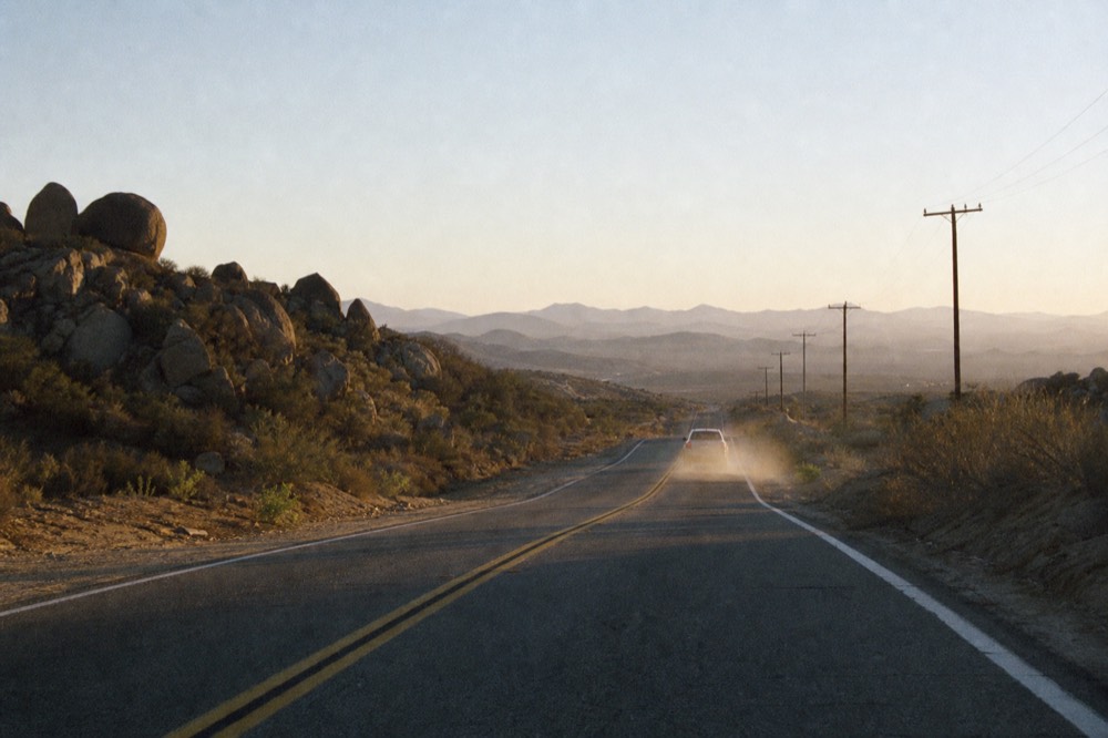 Open road heading south through Baja California hills, no text, no logos, no people