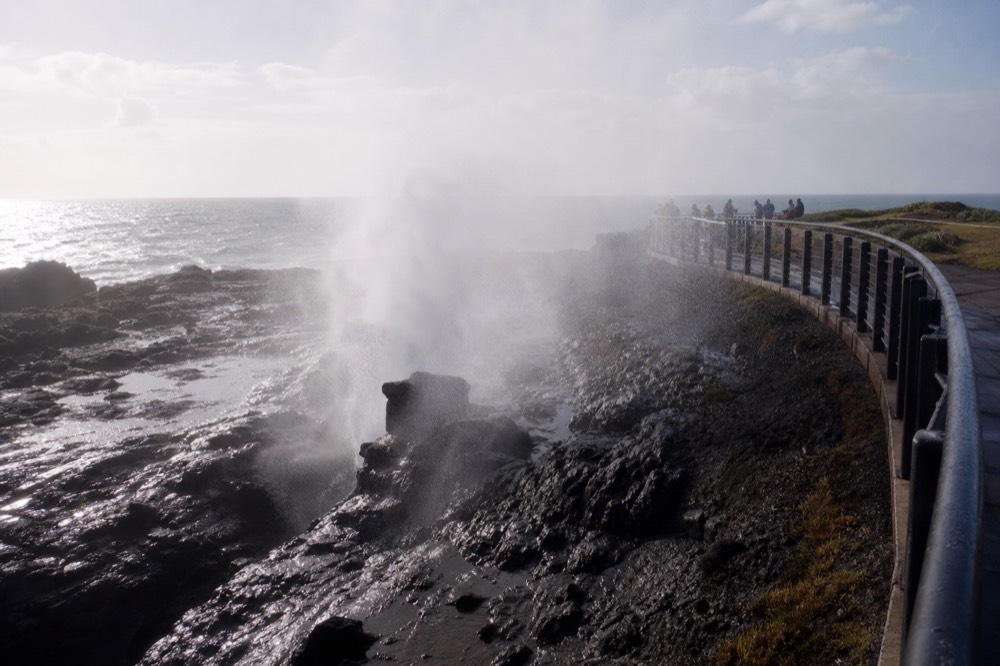 Ocean spray rising from a coastal blowhole near Ensenada, no text, no logos, no people