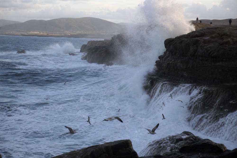 Ocean waves breaking against rocky cliffs near Ensenada on the Baja California coast, no text, no logos, no people